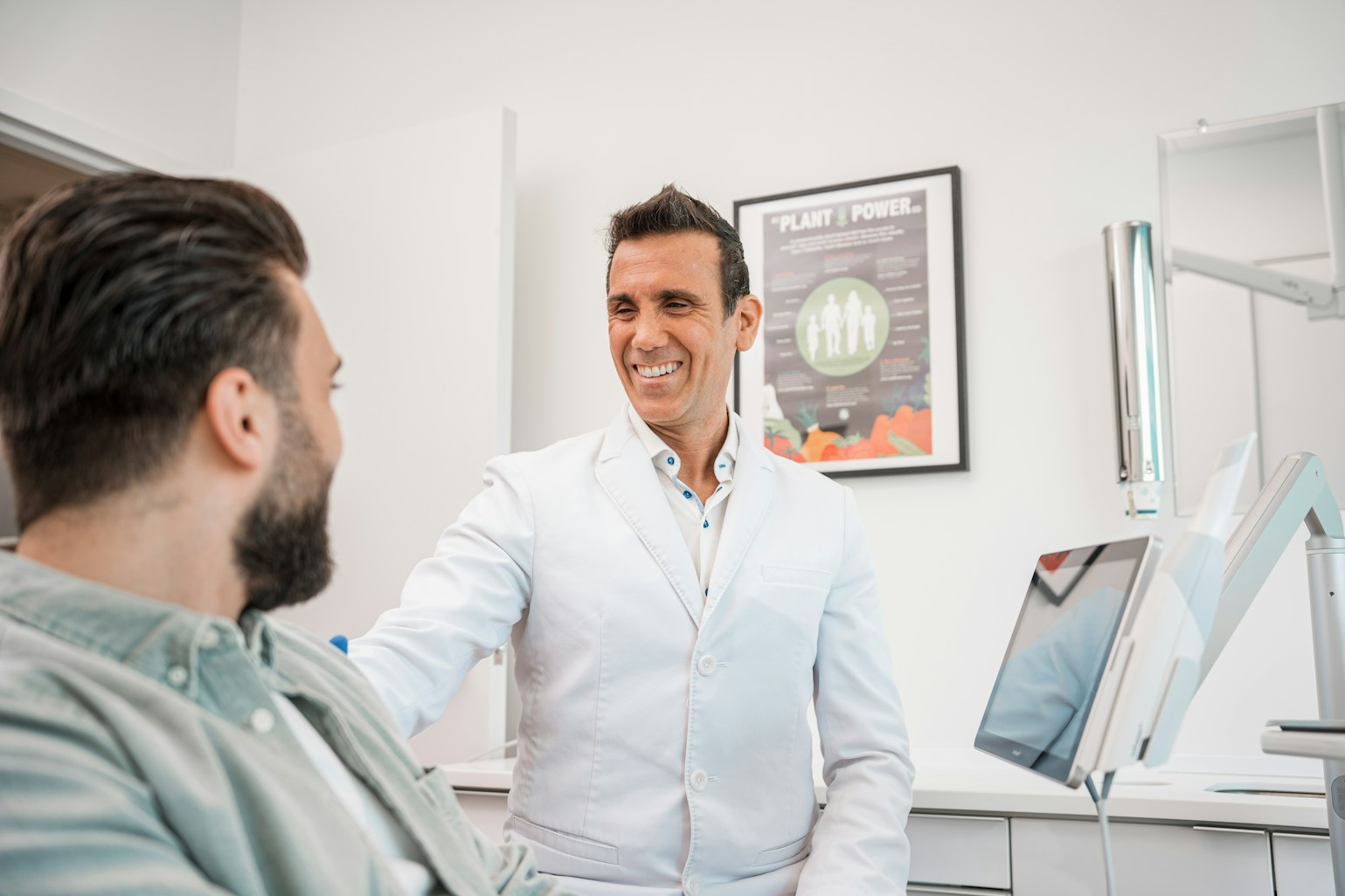 Dr. Vipin Giri discussing treatment costs with a patient at Kashvi Dental Clinic